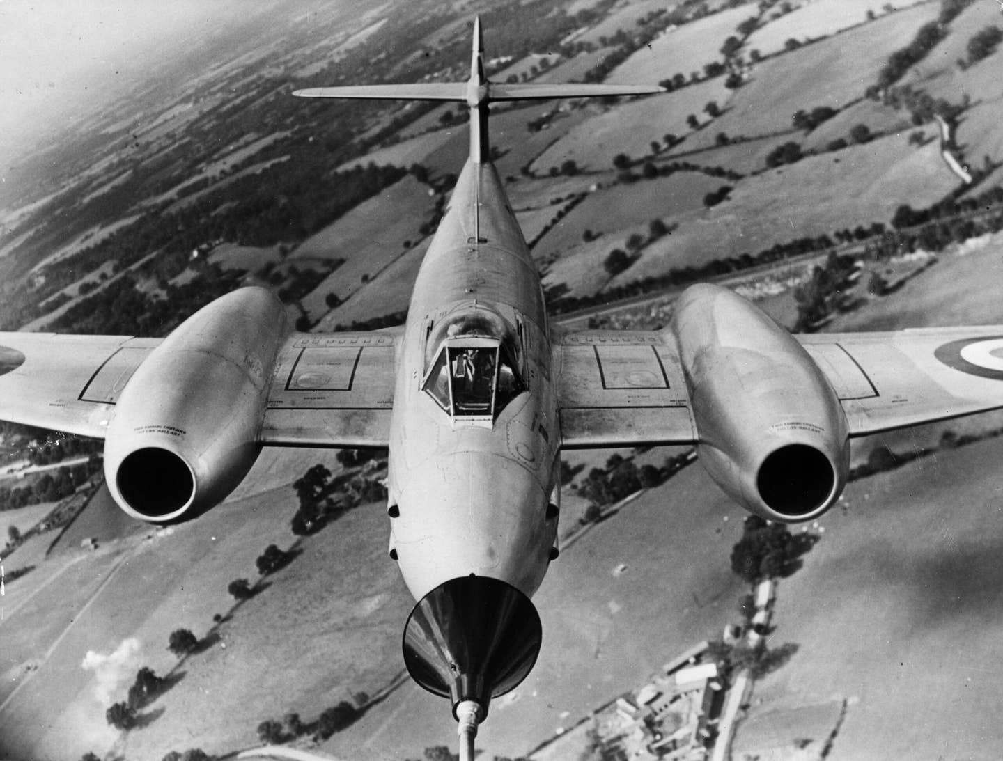 October 1950: A Gloster Meteor Mk 4 fighter tests the probe-and-drogue refueling system over Farnborough, England. <em>Photo by Keystone/Getty Images</em>