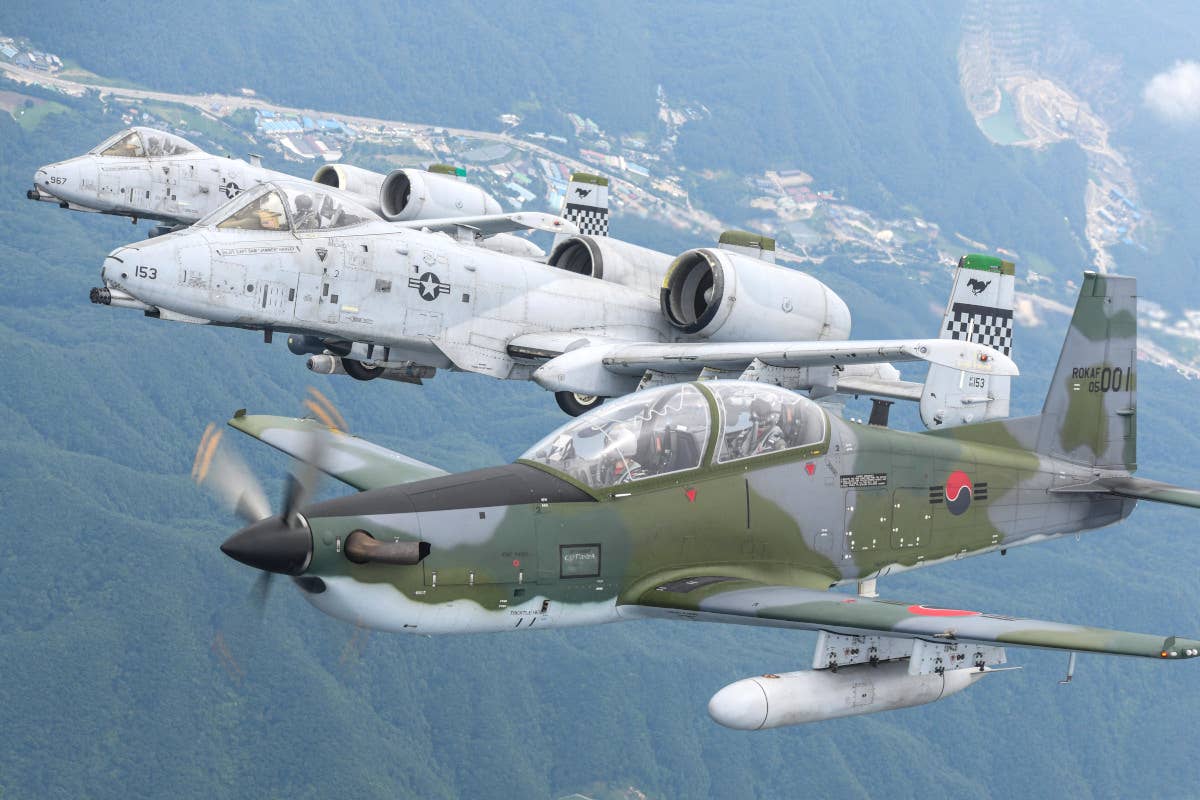 A-10s from the 51st Fighter Wing fly together with a South Korean KA-1 Woongbi light aircraft. <em>ROKAF</em>
