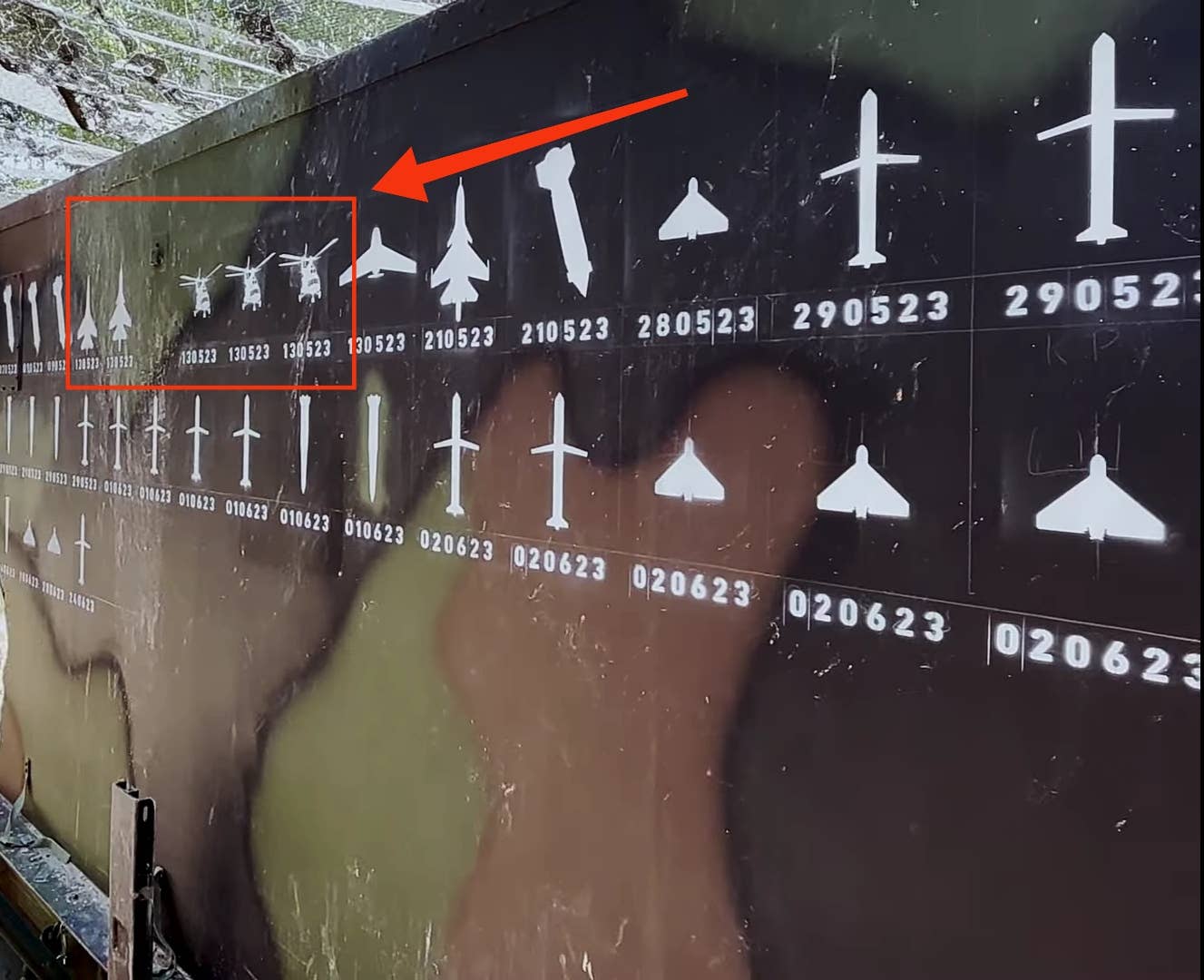A screen capture of the Ukrainian Air Force video shows images of three Russian helicopters and two Russian fighters painted on the side of a Patriot air defense battery. The three helicopter and two jet images bear the date May 13. (Defense Industry of Ukraine image)