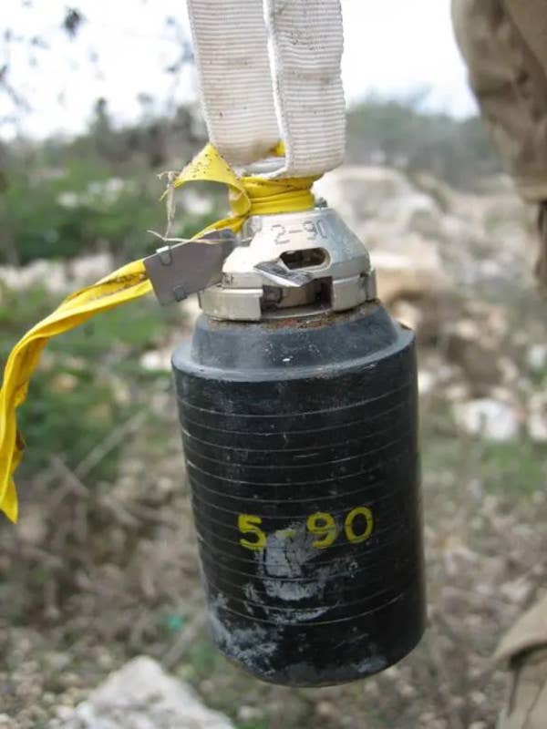 A dud Israeli-made version of the M85 DIPCM submunition seen after being rendered safe by United Nations personnel in Lebanon in 2006. <em>Bonnie Docherty/Human Rights Watch</em>