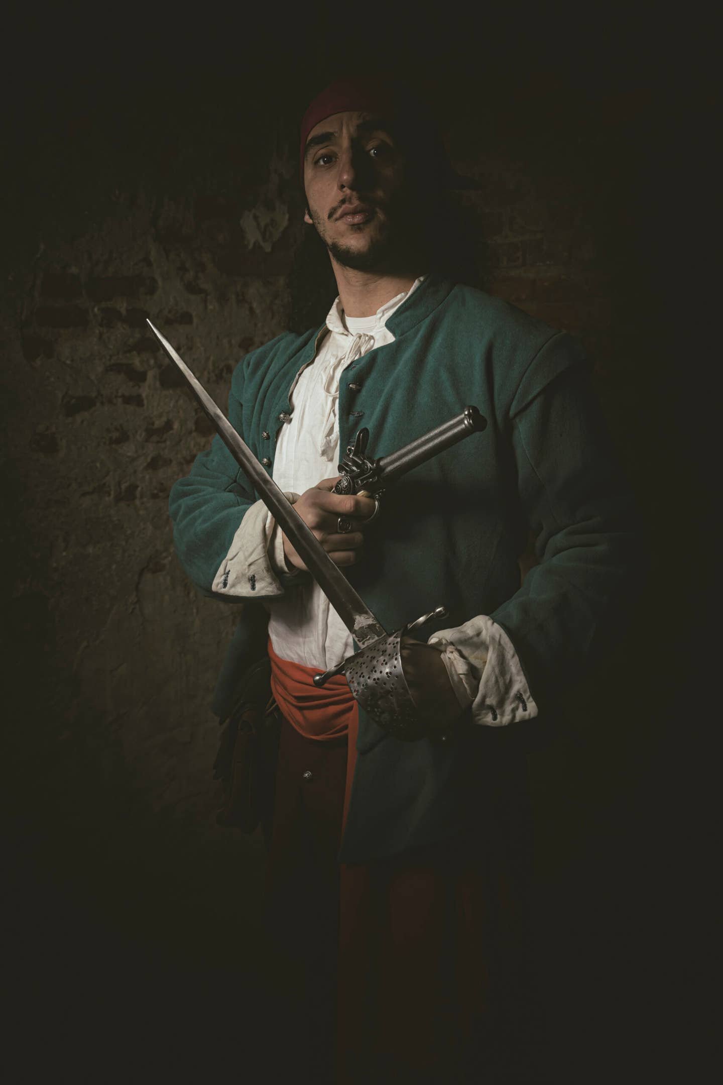 Another hypothetical reenactment of an English pirate in the Caribbean, sometime between 1680 and 1720. This pirate is armed with both a muzzle-loading gun and a short sword. <em>Photo by Camillo Balossini/Associazione Culturale Crapa de Mort/Mondadori Portfolio via Getty Images</em>