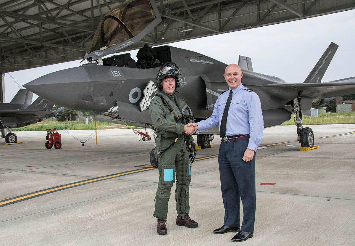 Air Vice Marshal (now Air Marshal) Harvey Smyth is seen in 2019 with Scott Williams, the then commanding officer of No 207 Squadron at RAF Marham, in front of an F-35B. <em>Crown Copyright</em>