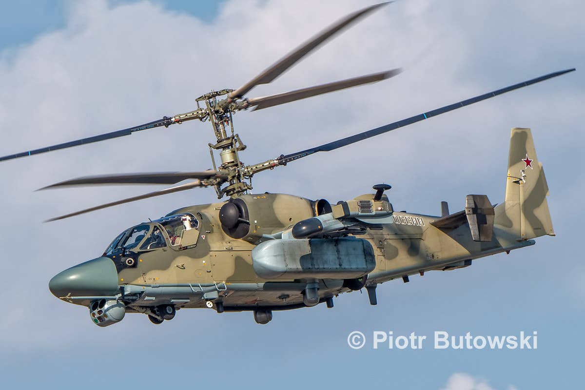 A test Ka-52M helicopter, which appeared in the air during MAKS 2021 airshow at Zhukovsky. This odd-shaped pod at the end of the left wing with a radio-transparent nose houses the AS-BPLA command line for communication between the helicopter and the LMUR missile. <em>Piotr Butowski</em>