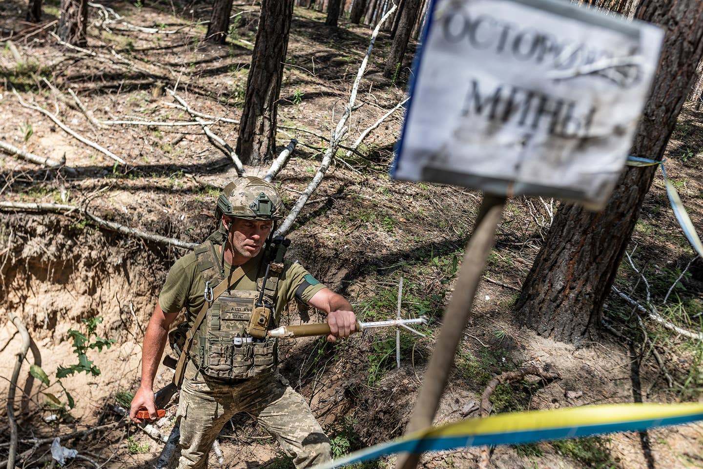 KHARKIV, UKRAINE - JULY 17: A Ukrainian soldier works on demining in forested land of Kharkiv Oblast, Ukraine on July 17, 2023. (Photo by Diego Herrera Carcedo/Anadolu Agency via Getty Images)