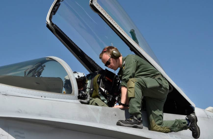 Finnish air force Master Sgt. Sami, plane captain, prepares to launch F-18 Hornet aircraft during exercise Air Defender 2023 (AD23) at Hohn, Germany, June 14, 2023.&nbsp;<em>U.S. Air National Guard photo by Tech. Sgt. Samara Underwood</em>
