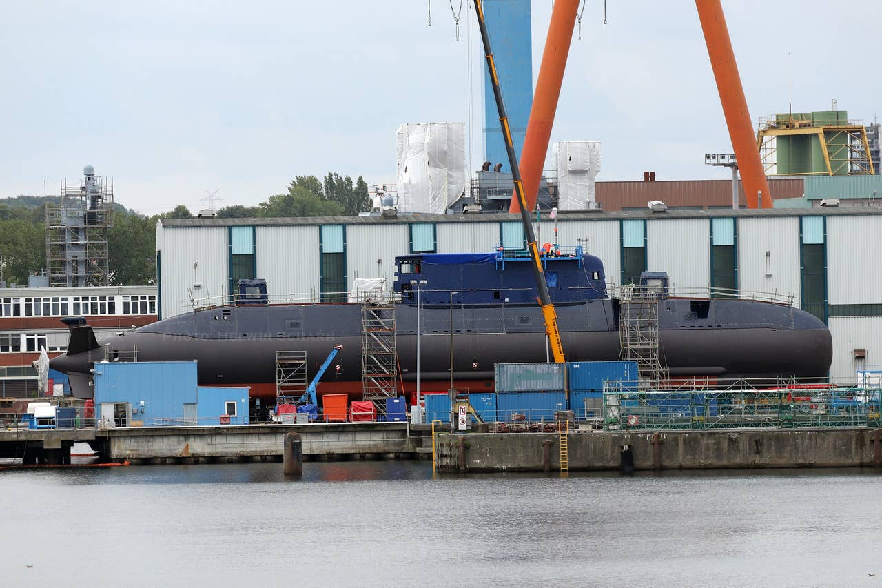 INS <em>Drakon</em> after it emerged out of the construction hall, in Kiel, Germany, on August 1, 2023. <em>Helwin Scharn</em>