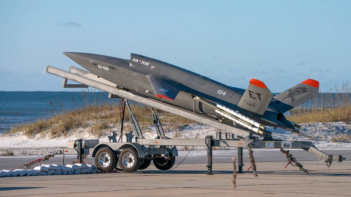 An XQ-58A on its trailer-based launcher at Eglin Air Force Base. <em>USAF</em>