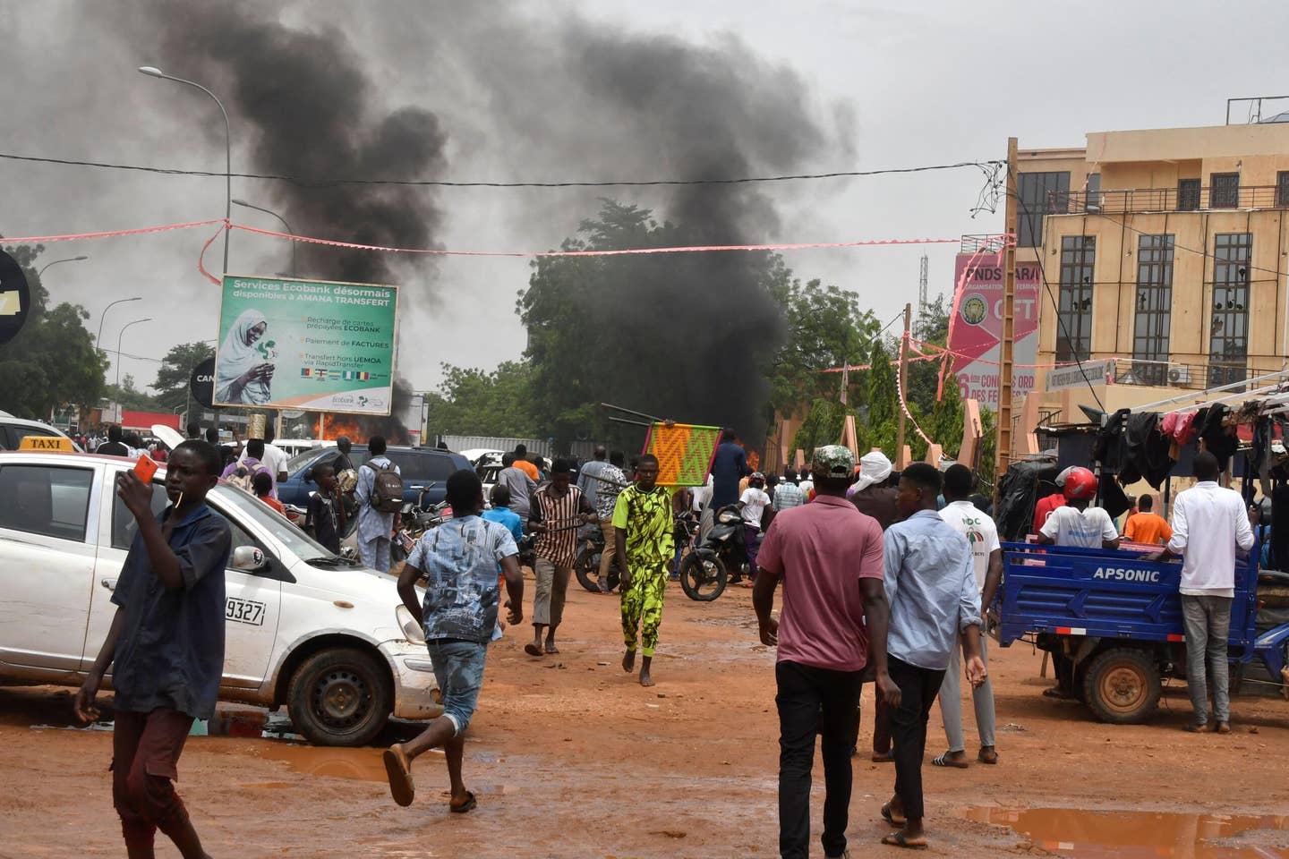 A general view of billowing smoke as supporters of the Nigerien defence and security forces attack the headquarters of the Nigerien Party for Democracy and Socialism (PNDS), the party of overthrown President Mohamed Bazoum, in Niamey on July 27, 2023.  (Photo by AFP) (Photo by -/AFP via Getty Images)