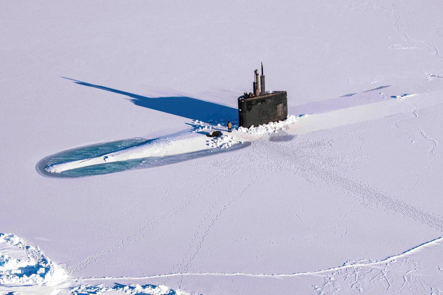 The <em>Los Angeles</em> class fast-attack submarine USS Pasadena (SSN 752) breaks through the ice in ICEX, which happened concurrently with Arctic Edge 2022, March 12, 2022. <em>U.S. Navy Photo by Mass Communication Specialist 2nd Class Trey Hutcheson</em>