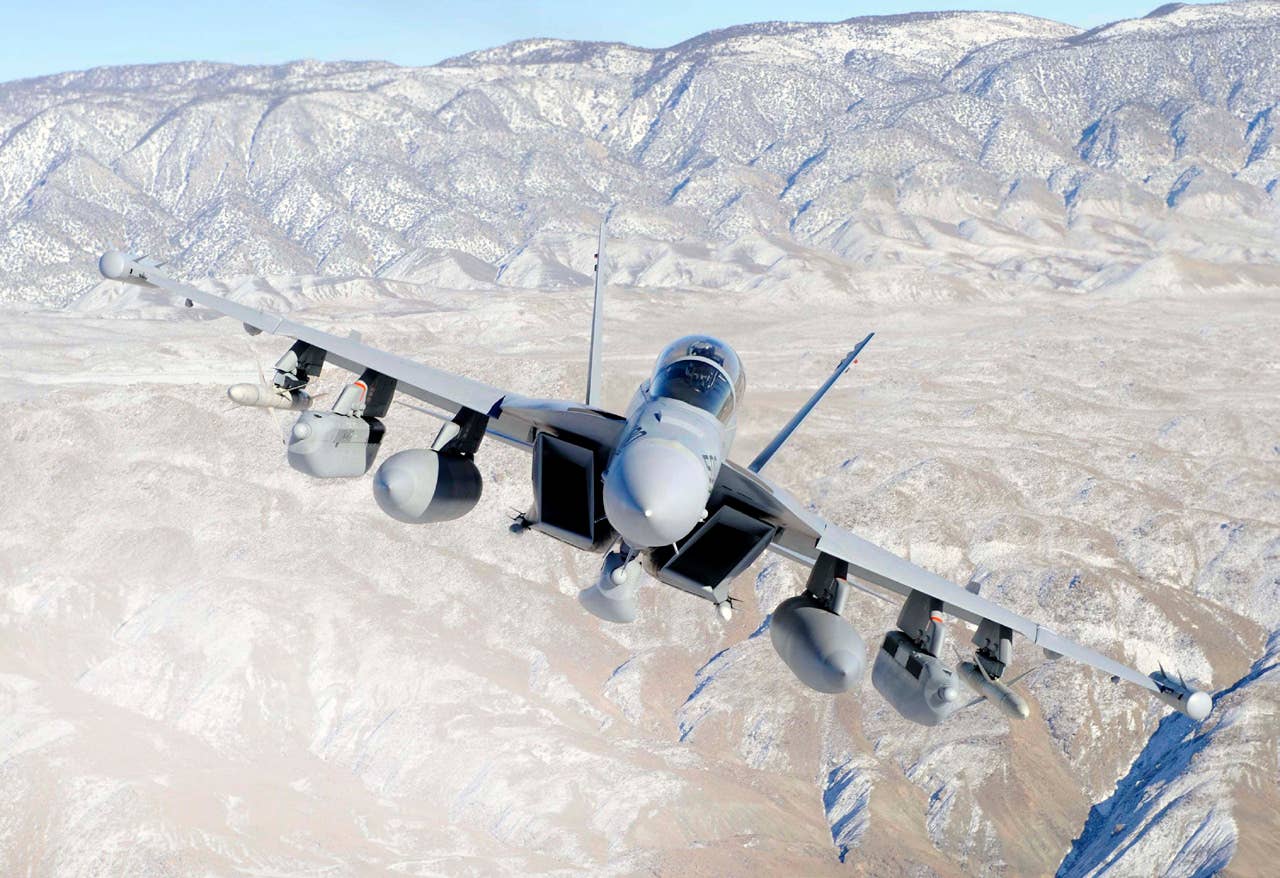 An EA-18G Growler flies over the California desert. Traditional concepts of electronic attack are going to give way to collaborative and cognitive electronic warfare, where disparate platforms work as a team to achieve EW goals across the battlespace and receive updates to confront new threats in near real time.