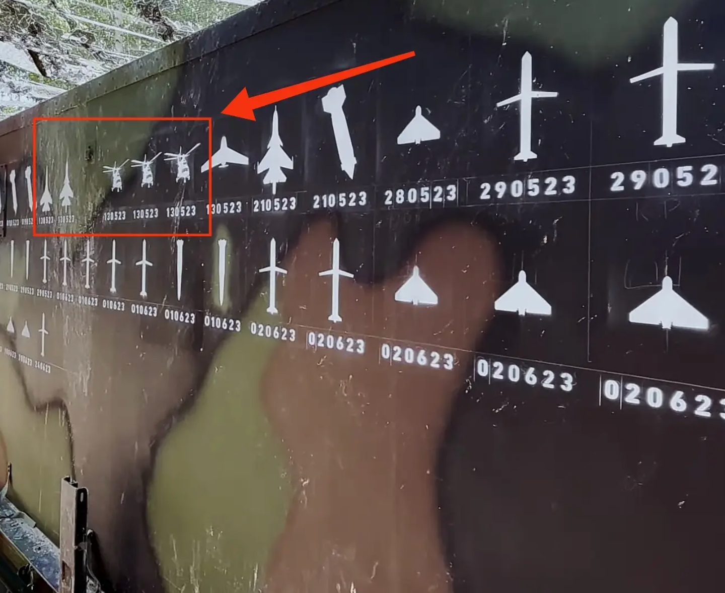 A screen capture of the Ukrainian Air Force video shows images of three Russian helicopters and two Russian fighters painted on the side of a Patriot air defense battery. The three helicopters and two jet images bear the date May 13. <em>Defense Industry of Ukraine image</em>