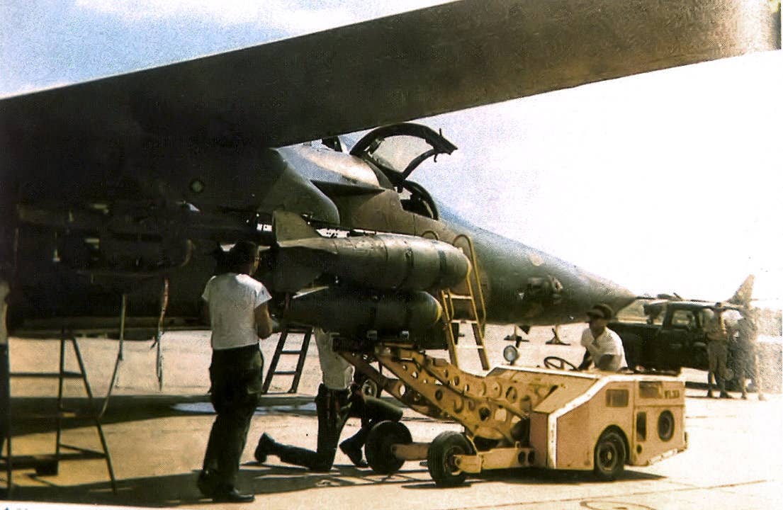 428th Tactical Fighter Squadron Combat Lancer F-111A being loaded with bombs, March 1968. <em>U.S. Air Force</em>