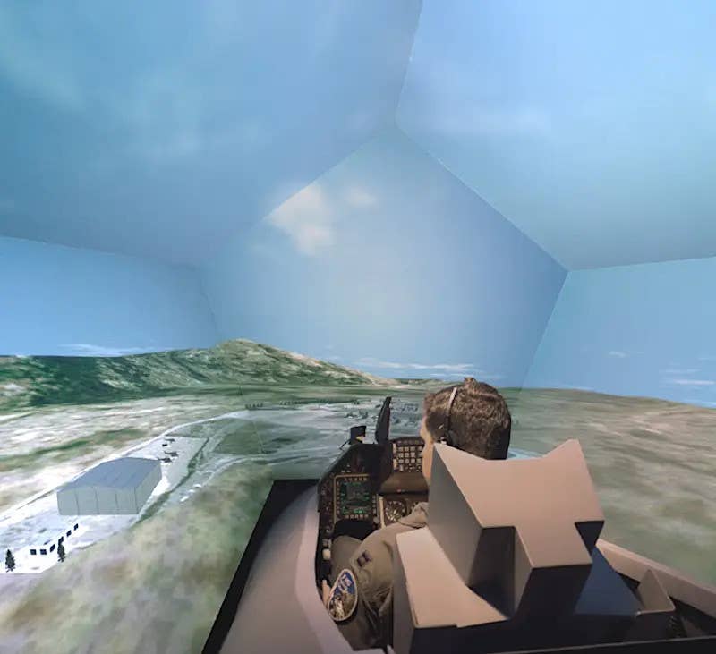 A pilot training in an F-16 simulator. <em>CAE</em>