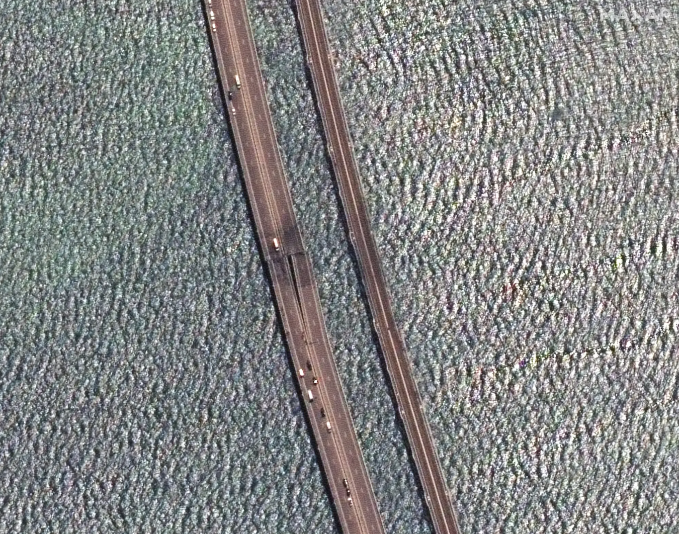 Close-up view of the damaged Kerch Bridge span. <em>Satellite image ©2023 Maxar Technologies</em>