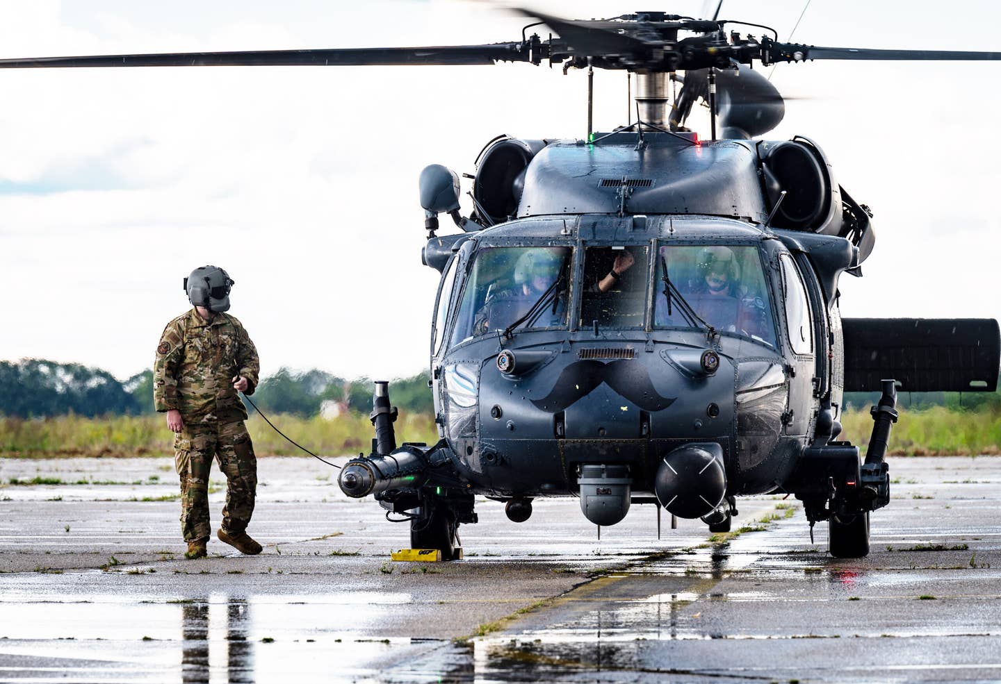 U.S. Air Force Tech Sgt. John Dwinell, 56th Rescue Generation Squadron flying crew chief, shuts down a U.S. Air Force HH-60G Pave Hawk helicopter at Batajnica Air Base, Serbia, Aug. 7, 2023. <em>U.S. Air Force photo by Airman 1st Class Edgar Grimaldo</em>