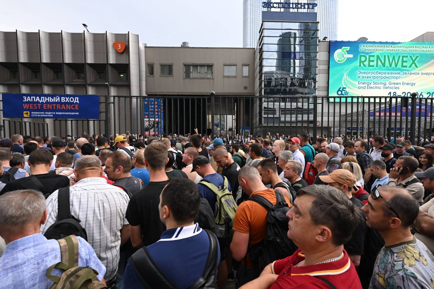 People and workers stand in line to enter a building within the Expo Center following the drone attack in Moscow on August 18, 2023. <em>Photo by NATALIA KOLESNIKOVA/AFP via Getty Images</em>