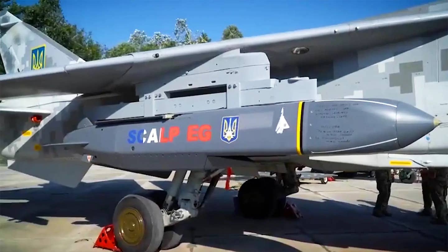 A SCALP-EG, the French variant of the Storm Shadow air-launched cruise missile, loaded under the wing of a Su-24 Fencer. <em>Ukrainian Ministry of Defense screencap<br></em>