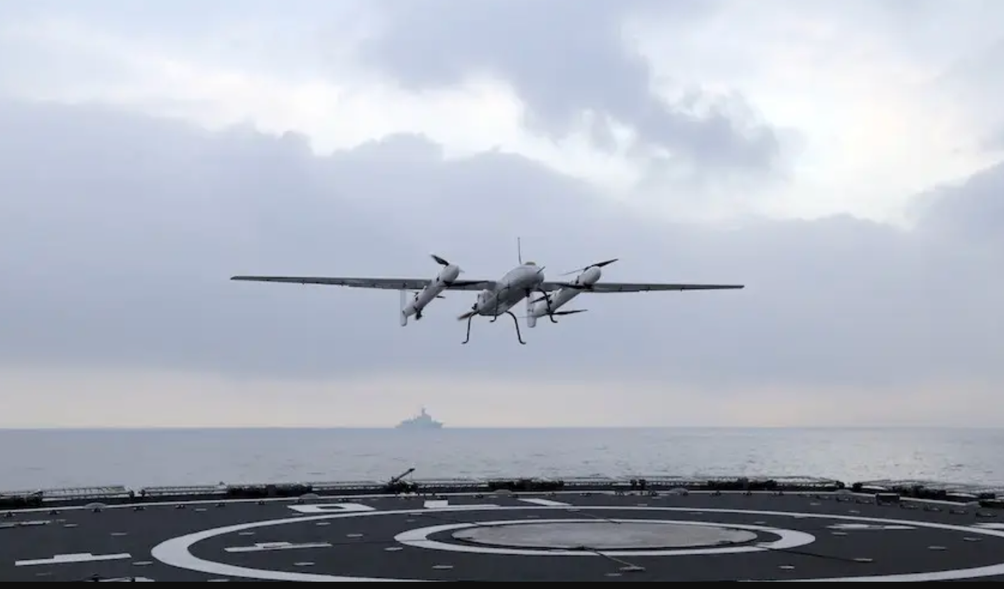 A Sea Cavalry SD-40 VTOL drone flying above the deck of a PLAN Type 052C destroyer during a test in 2019.&nbsp;<em>China Military Online</em>
