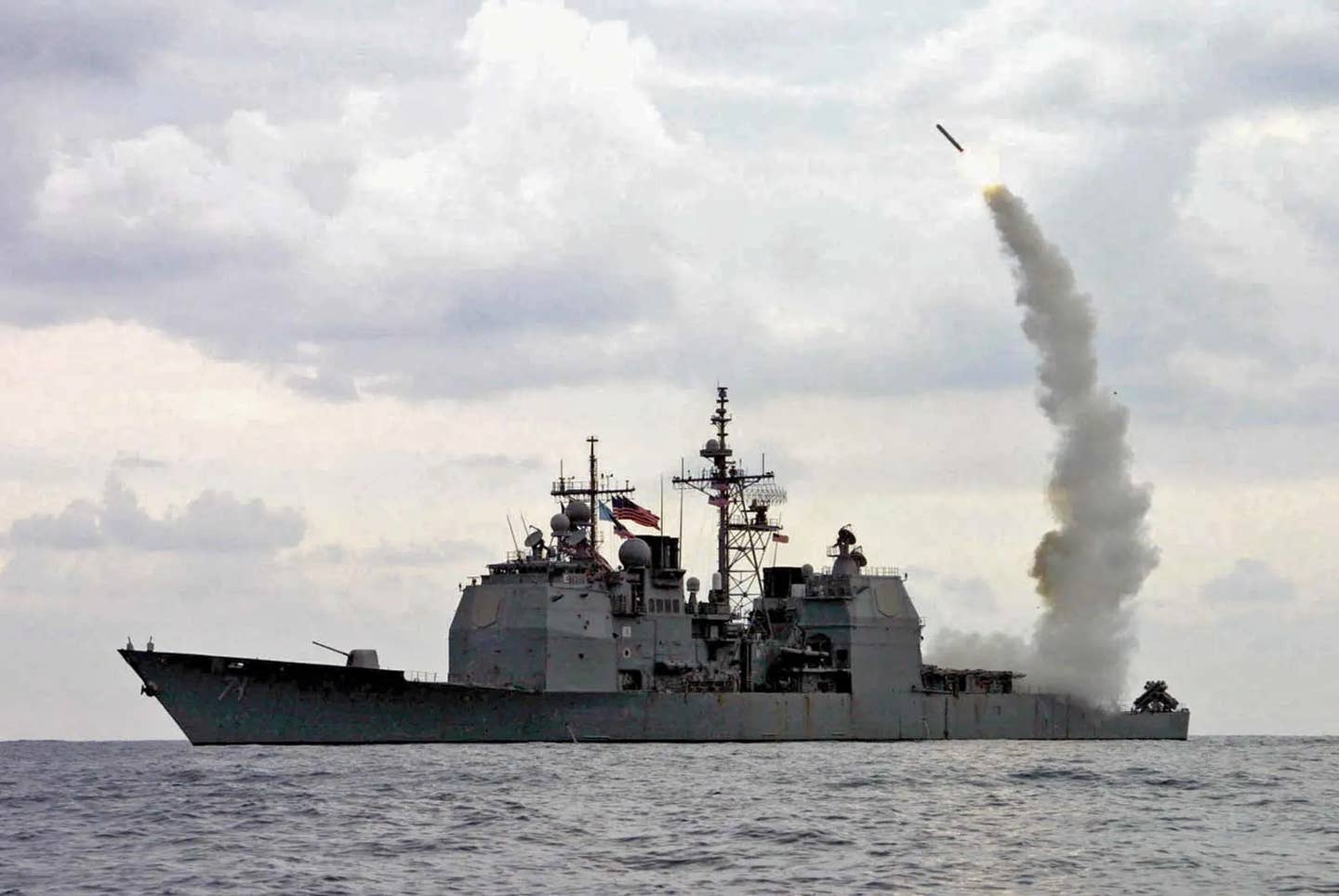 The <em>Ticonderoga</em> class cruiser USS <em>Cape St. George</em> launches a Tomahawk cruise missile. (USN)