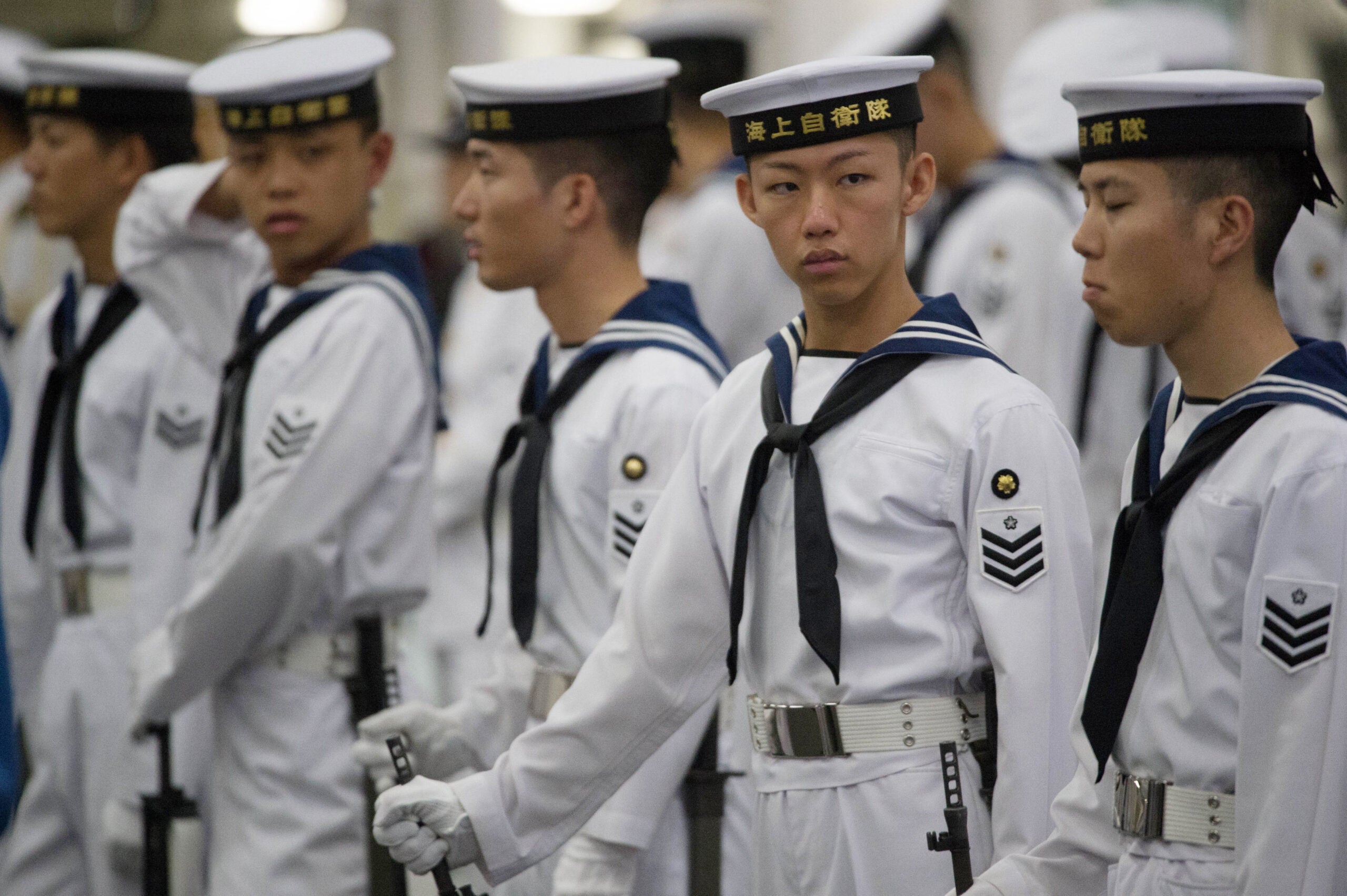 Sailors await for the arrival of Prime Minister Theresa May who met crew and naval personnel including those from the British Royal Navy on board the Japanese aircraft carrier, J.S. Izumo at Yokosuka Naval Base near Tokyo, Japan. (Photo by Stefan Rousseau/PA Images via Getty Images)