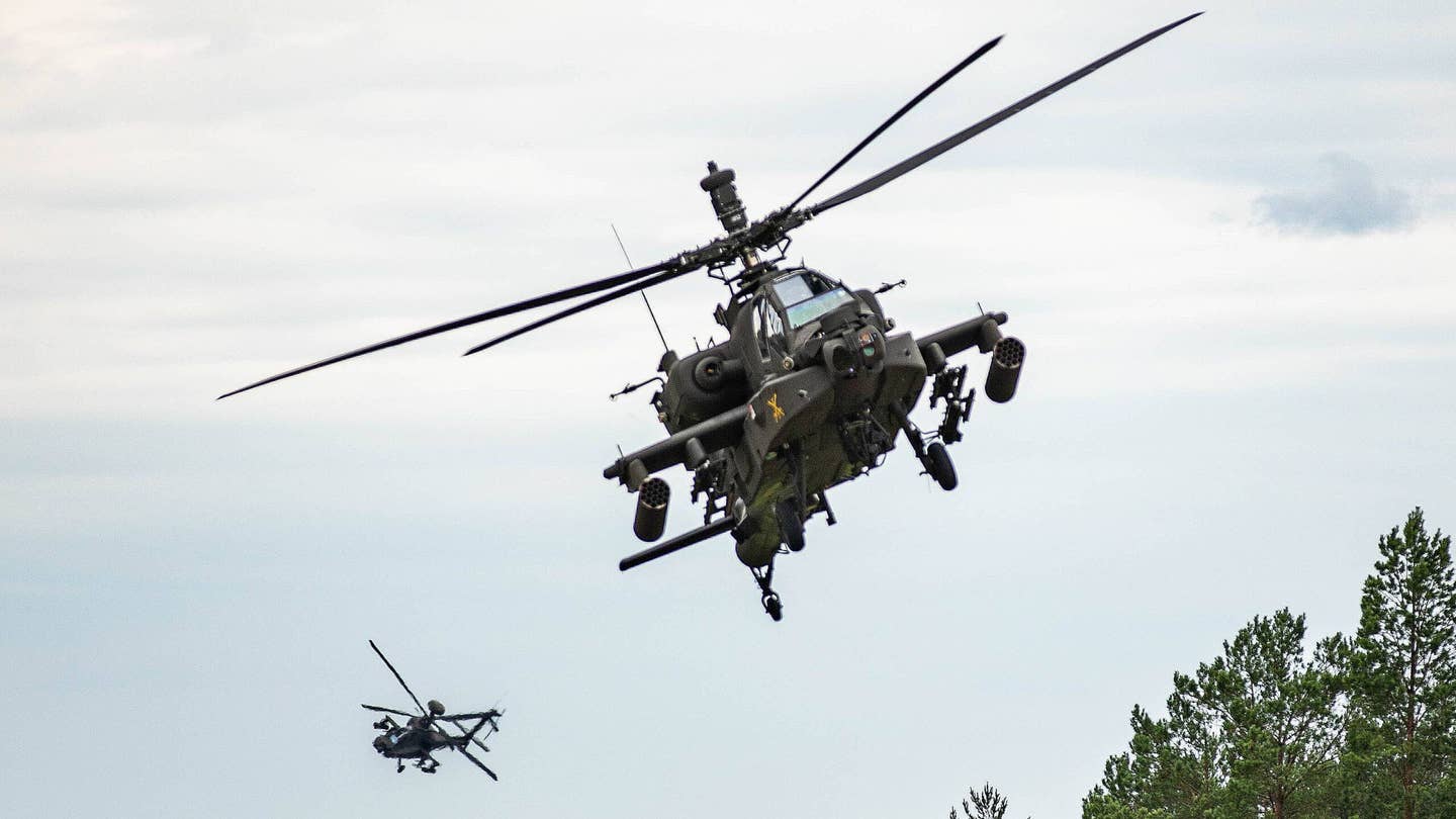 Army AH-64E flies with a MUMT-X hardware atop its mast. <em>U.S. Army</em>