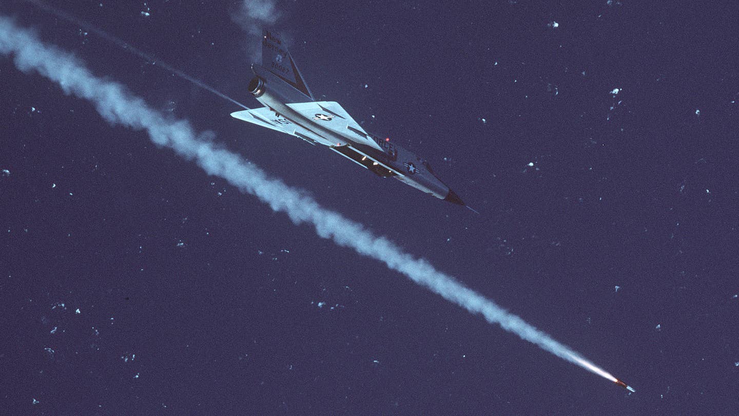 An F-106A Delta Dart of the New Jersey Air National Guard, firing an AIM-4 missile during William Tell '84. <em>USAF</em>