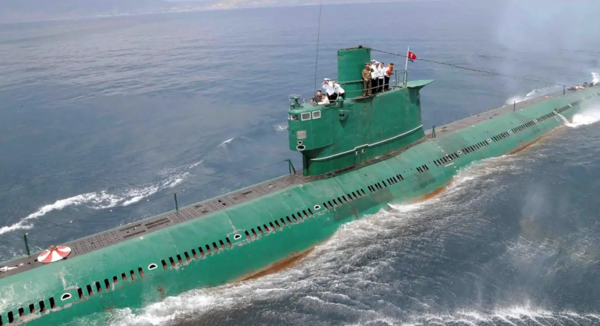 Kim riding on a <em>Romeo</em> class years ago. The type dates back to the 1950s and still makes up the backbone of the North Korean Navy's submarine fleet. (KCNA)