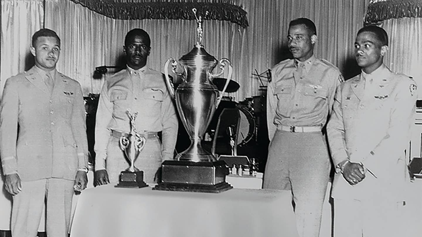 The four winning "Tuskegee Airmen" with the original “Top Gun” trophy in 1949. <em>USAF</em>