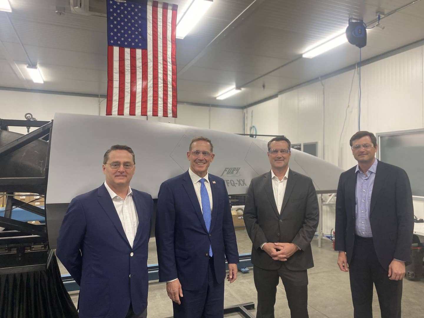 Scott Bledsoe, then president of Blue Force Technologies, second from the right, along with Senator Ted Budd, a North Carolina Republican, second from the left, and others, at one of the company's facilities earlier this year. <em>Scott Bledsoe/LinkedIn</em>