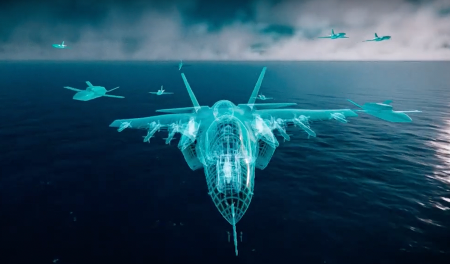 A screencap from a QinetiQ video depicts Jackdaw drones operating alongside an F-35 fighter as well as other types of larger uncrewed aircraft. <em>Lockheed Martin</em>