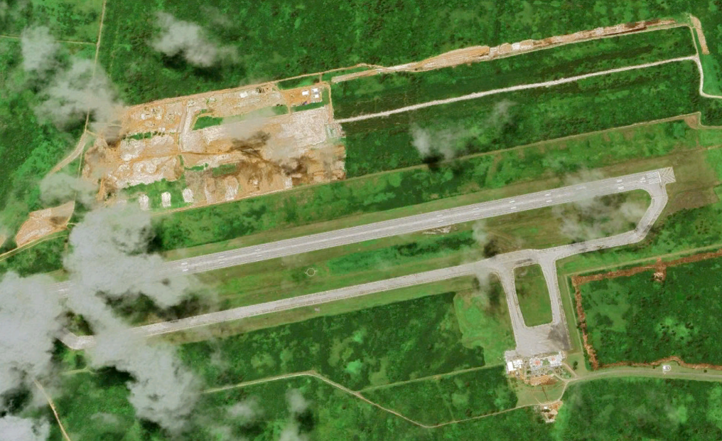 A satellite image from Planet Labs of Tinian International Airport taken in June , 2023, with new U.S. military-related construction visible to the northwest. (Google Earth)