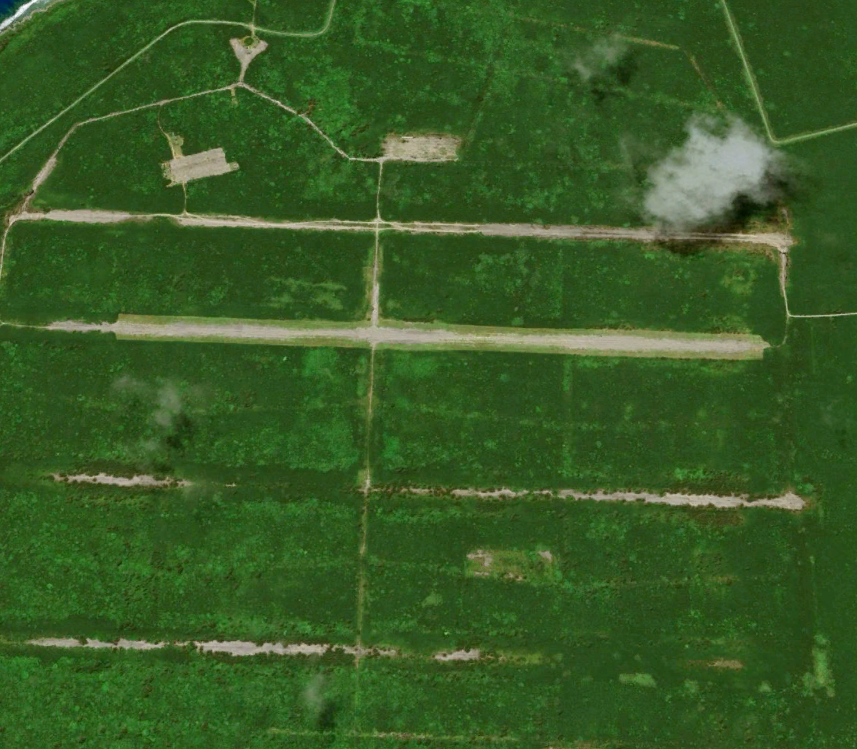Satellite image of the historic north field on Tinian. Clearing work has been done on one of the strips here and more is to come. (Google Earth)