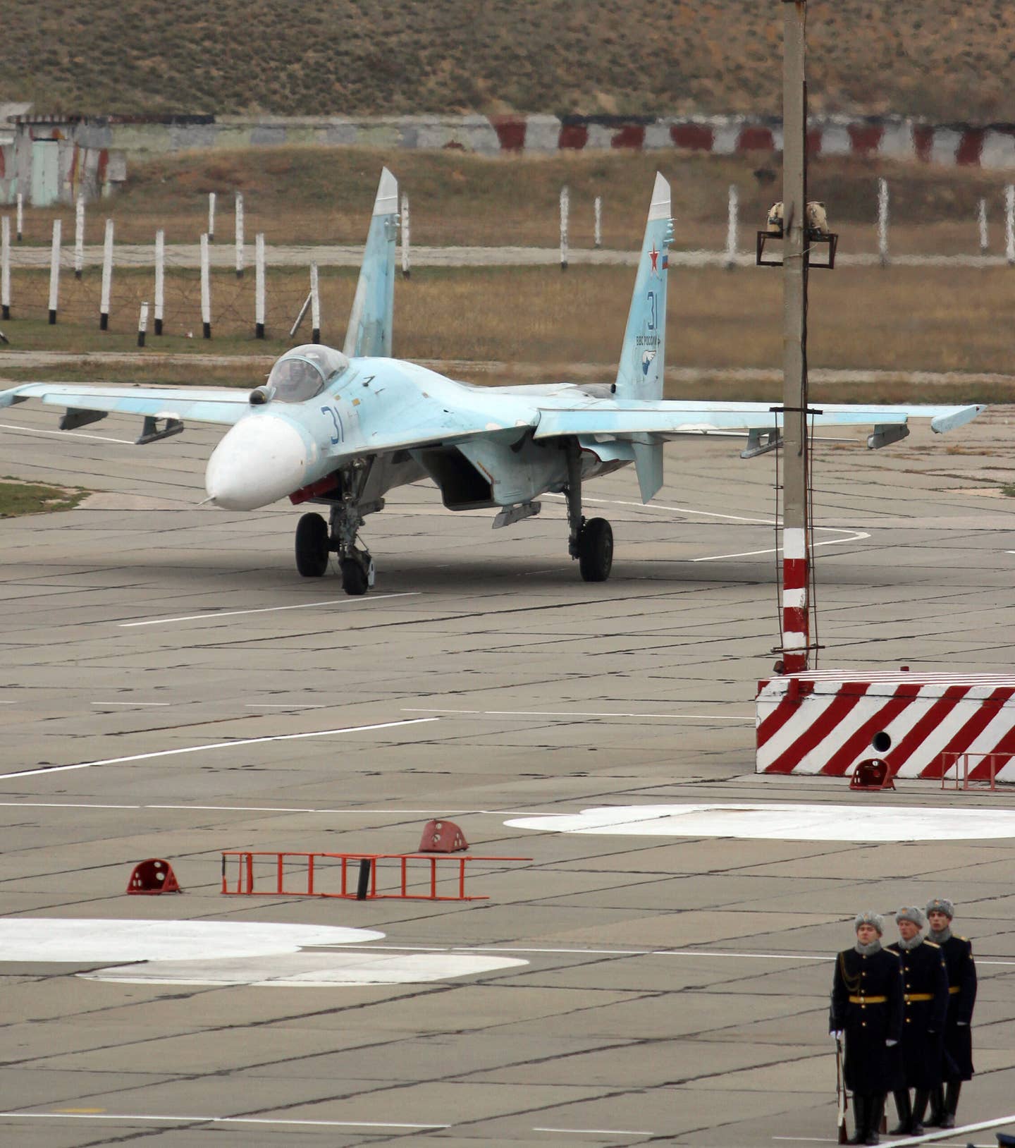 A Russian Su-27 fighter lands on the airfield of Belbek military airport outside Sevastopol on November 26, 2014. At this point, Russian airpower in Crimea was being reinforced after the annexation of the peninsula. <em>Photo by YURIY LASHOV/AFP via Getty Images</em>