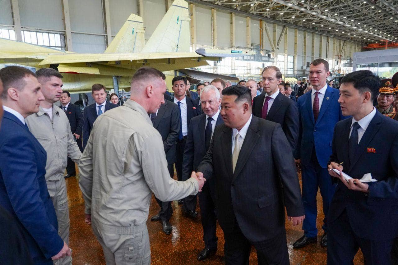North Korean leader Kim Jong Un visits the KnAAPO aircraft factory, accompanied by Russian Deputy Prime Minister and Minister of Industry and Trade, Denis Manturov (third from right), on September 15, 2023. <em>Photo by Gov of Khabarovsk Reg/M. Degtyaryov/Anadolu Agency via Getty Images</em>