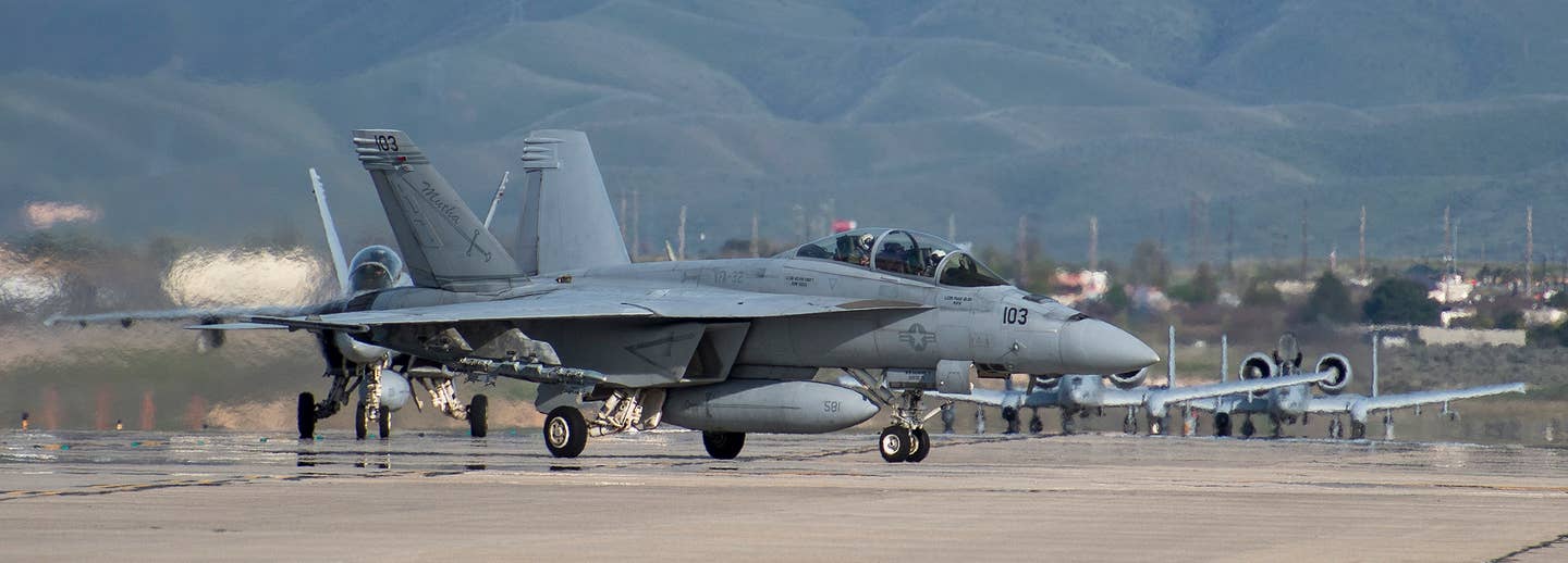 Super Hornets and A-10s taxi during a unique set of drills at Gowen Field in Boise, Idaho. (U.S. Air Force photo by Senior Airman Preston Webb)