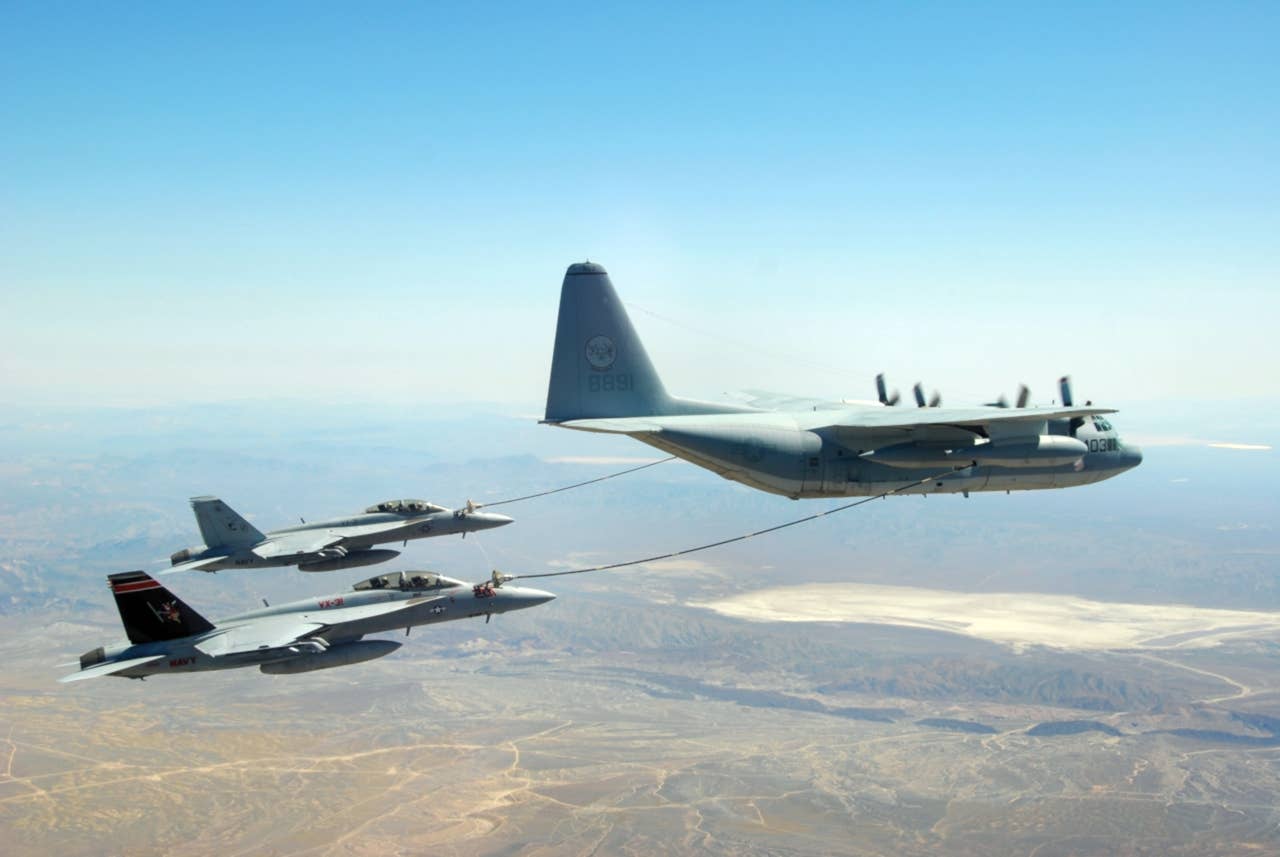 Super Hornets refuel from a KC-130T. (U.S. Navy photo by Cmdr. Ian C. Anderson)