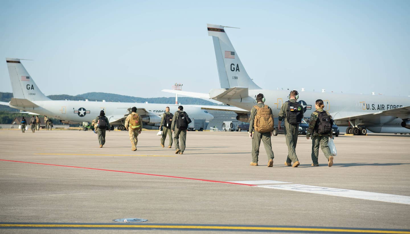 U.S. Air Force airmen assigned to the 10th Expeditionary Airborne Command and Control Squadron walk toward an E-8C JSTARS at Ramstein Air Base, Germany. <em>U.S. Air Force/Airman 1st Class Jared Lovett</em><br>