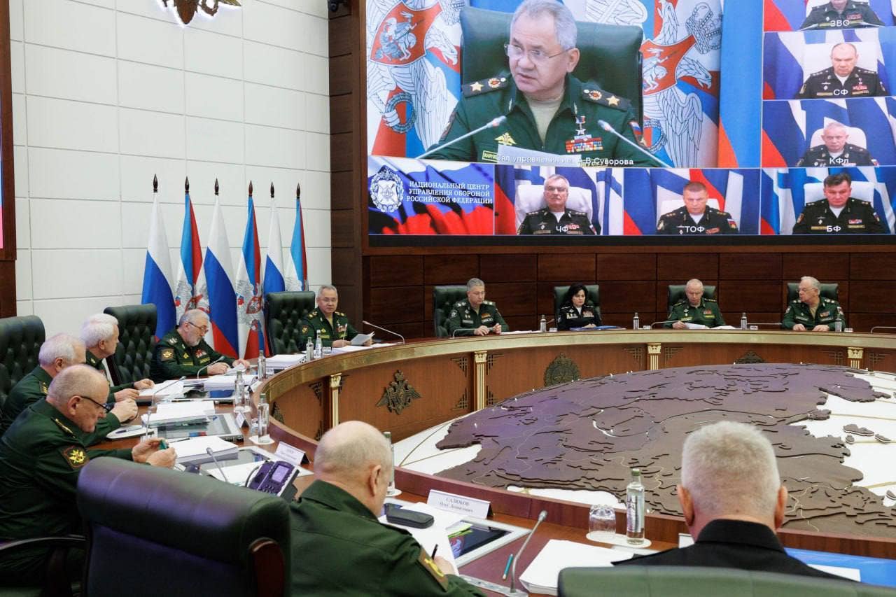Russian Adm. Viktor Sokolov is seen on the big screen, just under Defense Minister Sergei Shoigu, in this image posted by the Russian MoD. (Russian MoD)