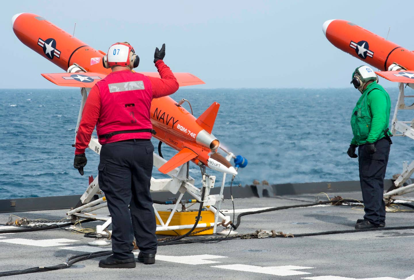 Sailors prepare to launch a BQM-74E target drone on the flight deck of the amphibious dock landing ship USS <em>Germantown</em> (LSD-42) during a missile exercise. <em>U.S. Navy photo by Mass Communication Specialist 2nd Class Will Gaskill/Released</em>