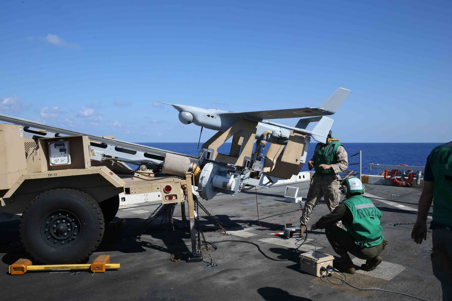 Marines attached to the 15th Marine Expeditionary Unit’s (15th MEU) Unmanned Aerial Surveillance unit launch an RQ-21A Blackjack small tactical unmanned aircraft system aboard the <em>San Antonio</em> class amphibious transport dock ship USS <em>San Diego</em> (LPD-22), September 26, 2017.  <em>U.S. Marine Corps photo by Lance Cpl. Jeremy Laboy/Released</em>