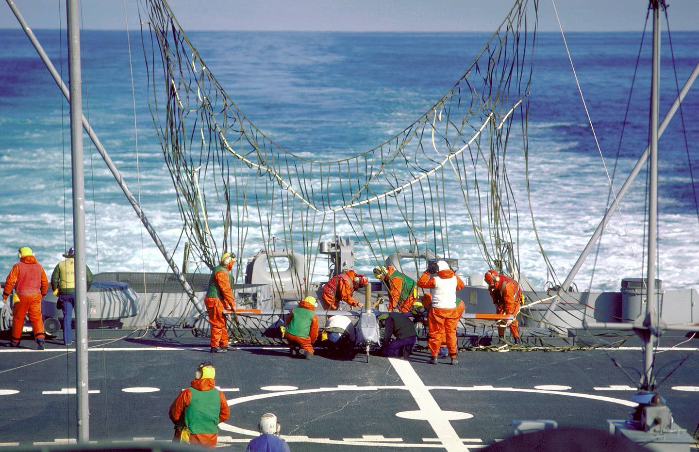 The Navy operating drones from ships other than aircraft carriers is not altogether new. Here, crewmen disengage a Pioneer I drone from a recovery net erected on the stern of the battleship USS&nbsp;<em>Iowa</em>&nbsp;(BB-61), back in 1986. <em>U.S. Navy</em>