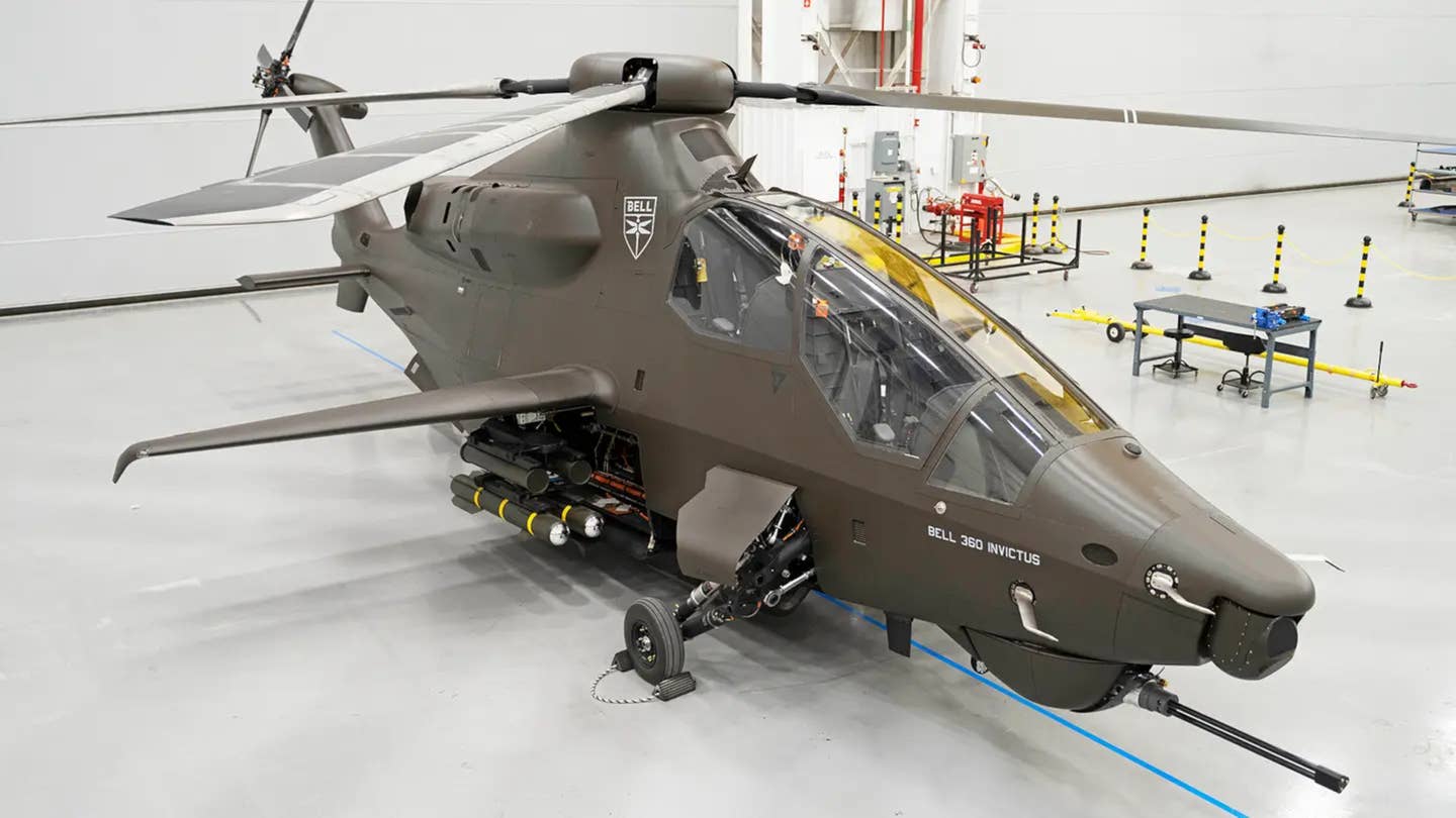 A picture of the initial 360 Invictus helicopter prototype with a more expected array of mockup stores on weapons racks extending out from its internal weapon bay. <em>Bell</em>