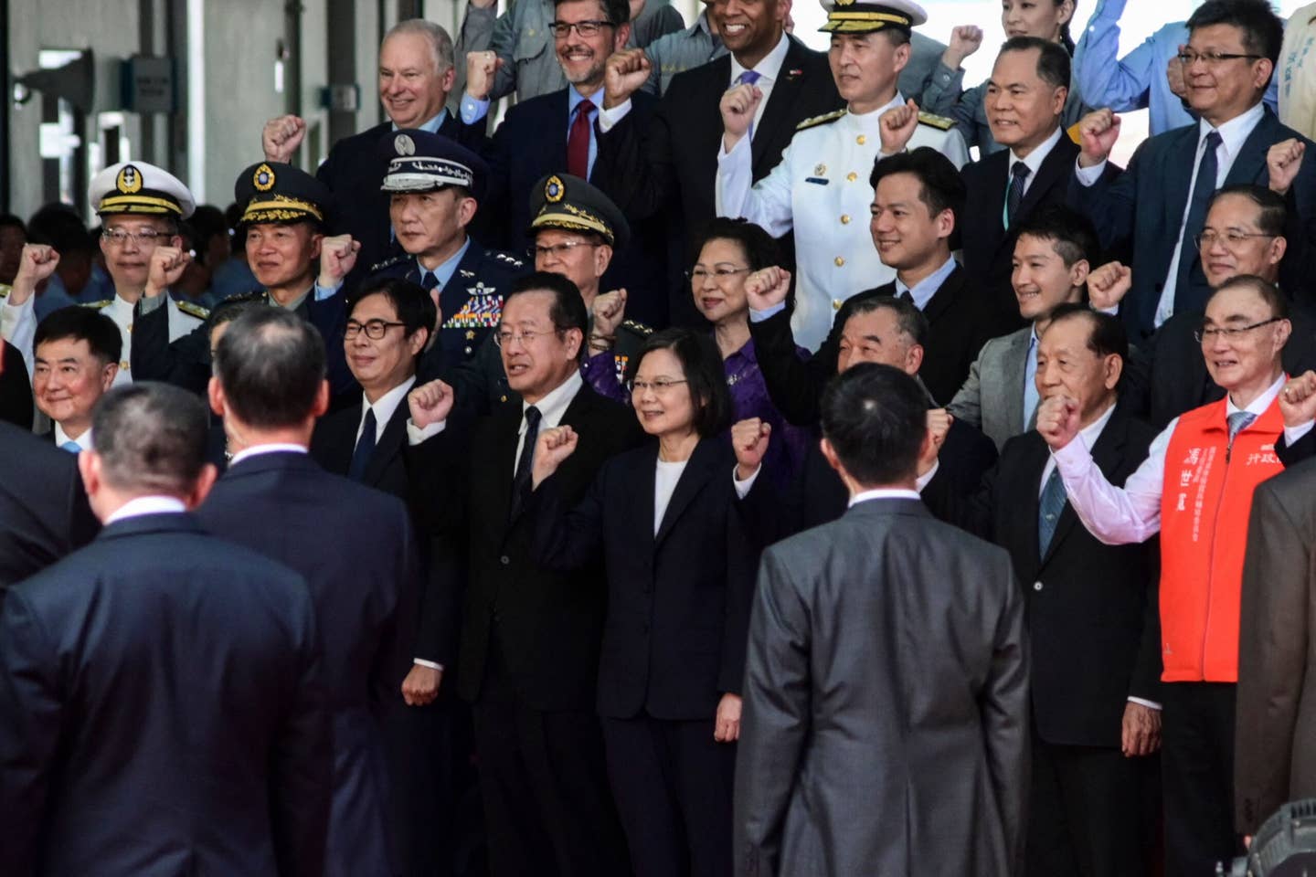 Taiwanese President Tsai Ing Wen (center) poses for a photo during a ceremony to unveil the first locally built submarine, the <em>Hai Kun</em>, at the CSBC Corp. shipbuilding company in Kaohsiung on September 28, 2023. <em>Photo by SAM YEH/AFP via Getty Images</em>