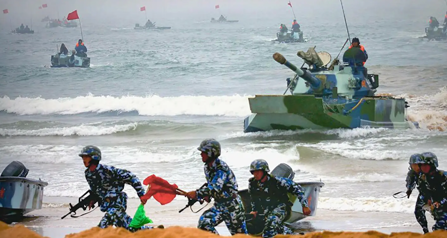Chinese marines race ashore accompanied by amphibious tanks during a beach assault exercise.&nbsp;<em>PLA</em>