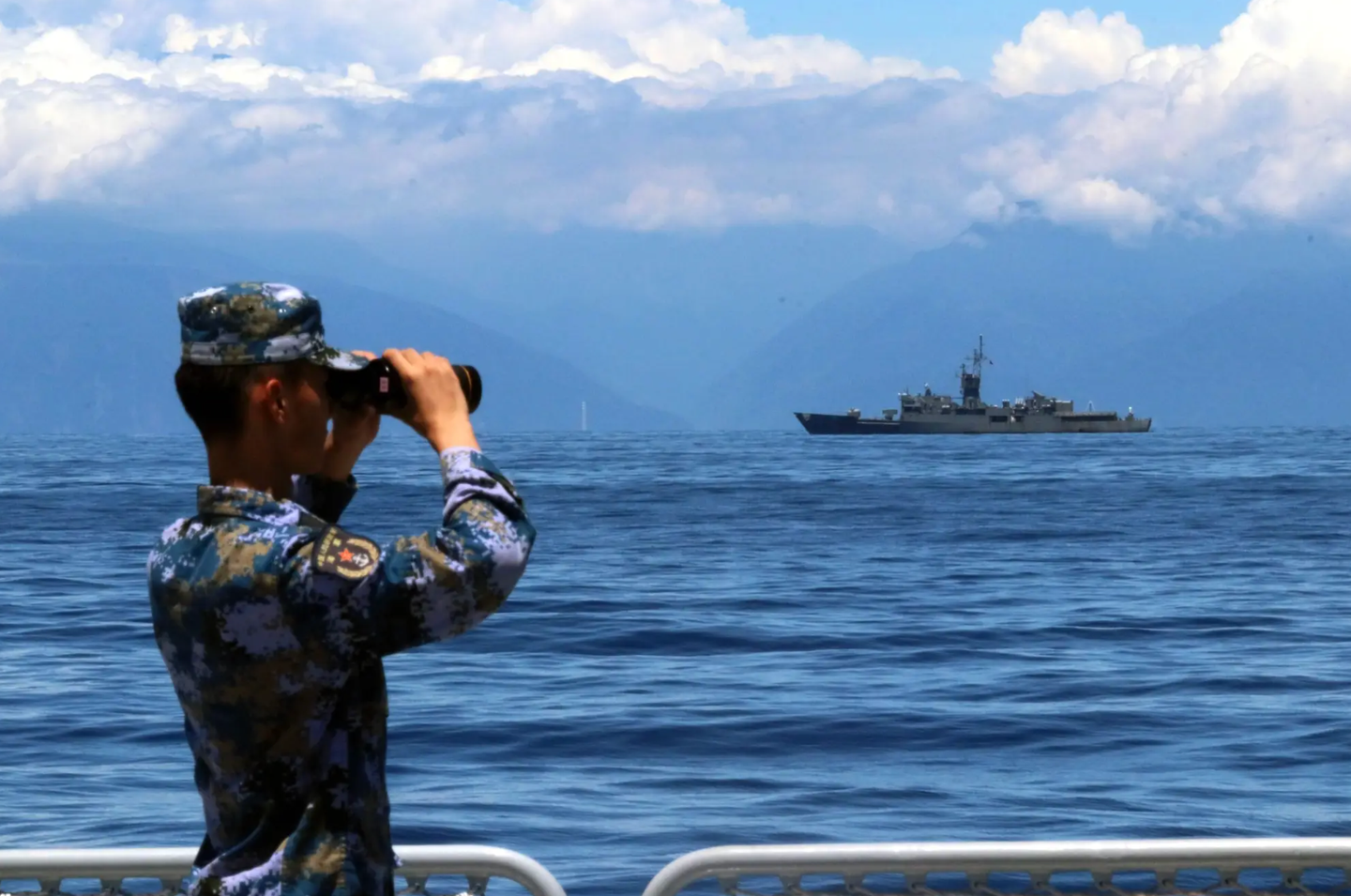 A PLA soldier looks through binoculars during combat exercises and training of the Eastern Theater Command of the Chinese People’s Liberation Army in the waters around Taiwan, August 5, 2022.&nbsp;<em>Photo by Lin Jian/Xinhua via Getty Images</em>