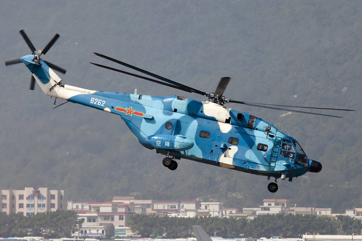 A Chinese People's Liberation Army Z-8 helicopter in a blue-based camouflage scheme. Allen Zhao via Wikimedia