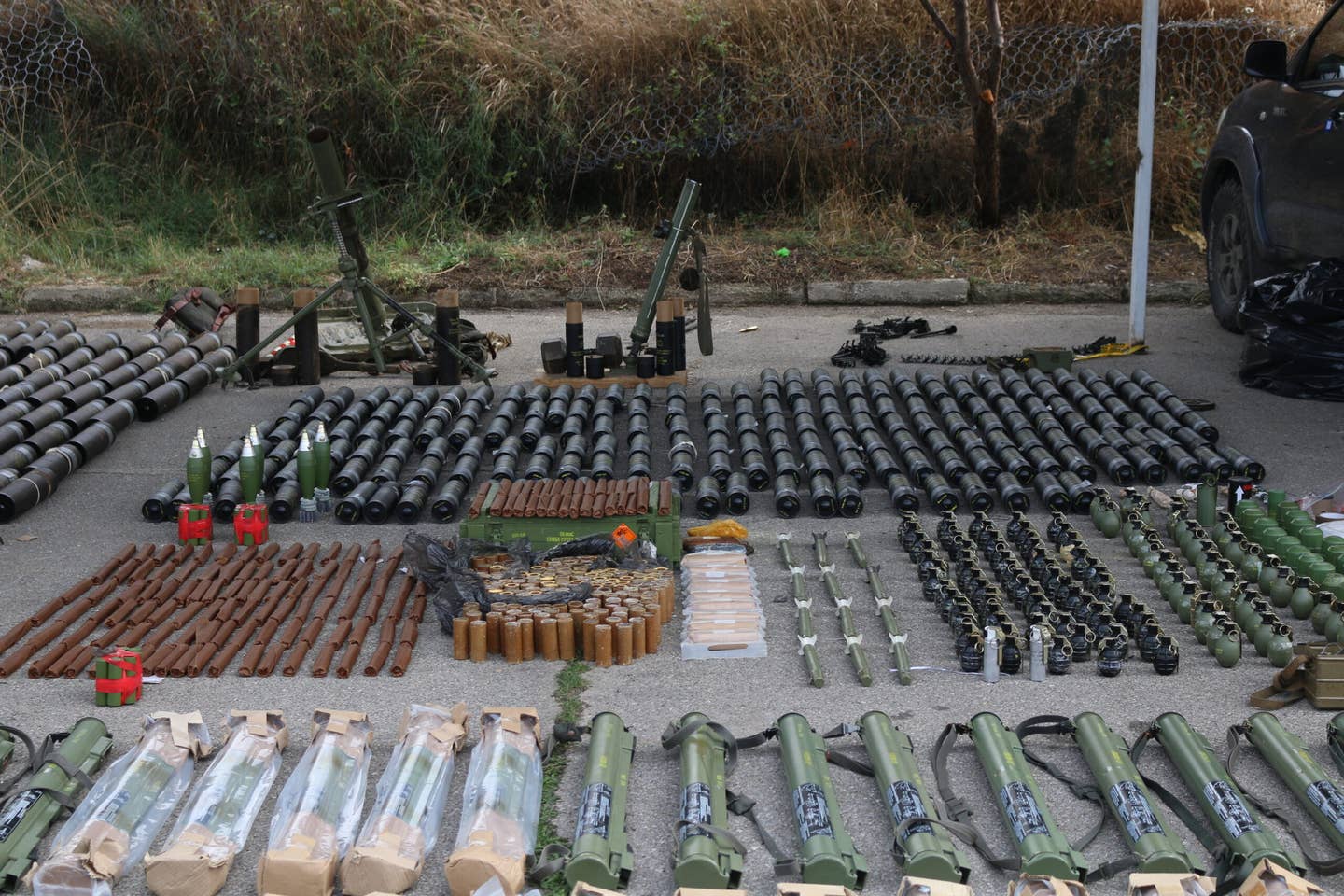 Heavy weapons, vehicles, and ammunition are displayed, after they were seized following the day-long clashes with an armed Serb group in Banjska, Kosovo, on September 25, 2023. <em>Photo by Erkin Keci/Anadolu Agency via Getty Images</em>