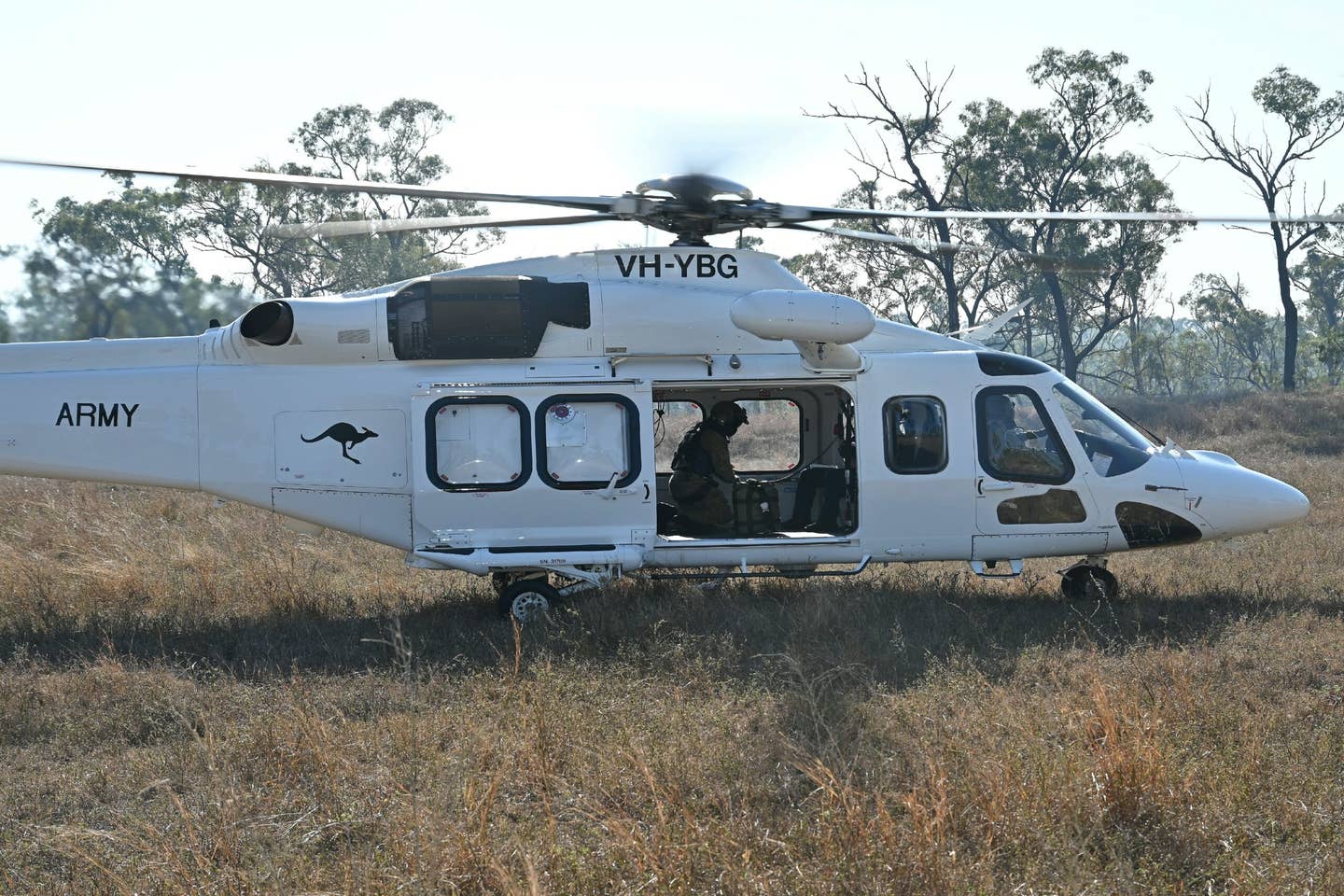 An AW139 helicopter serving with the 5th Aviation Regiment prepares to take off from Townsville Field Training Area, Queensland. These aircraft are leased from Helicorp and are flown by Australian Army aircrew. <em>COMMONWEALTH OF AUSTRALIA, DEPARTMENT OF DEFENSE</em>