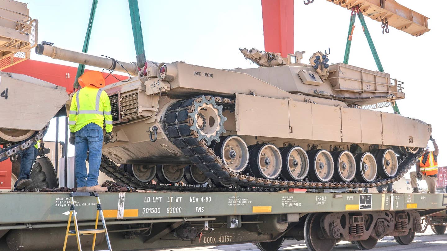 A US Marine Corps M1 Abrams is loaded onto a truck as part of the service's divestment of these tanks in 2020. <em>USMC</em>