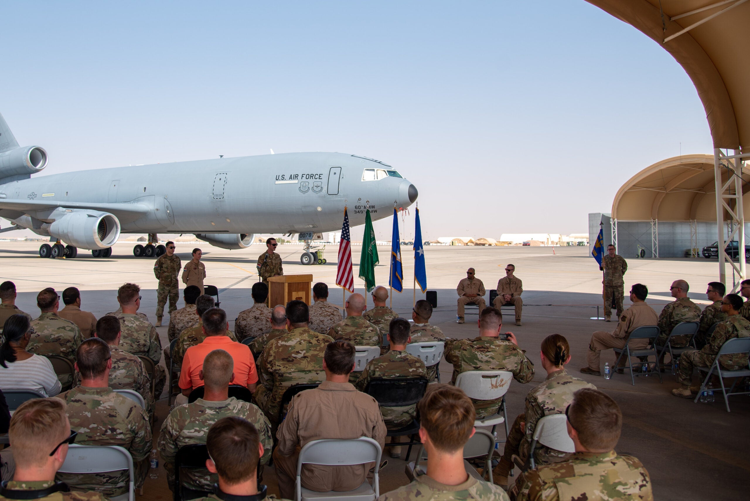 U.S. Airmen from the 378th Air Expeditionary Wing gather for the 908th Expeditionary Air Refueling Squadron's inactivation ceremony at Prince Sultan Air Base, Kingdom of Saudi Arabia, Oct. 4, 2023. The ceremony highlighted the legacy of the KC-10 after over 30 years of service within the U.S. Air Forces Central (AFCENT) Area of Responsibility. By September 2024, the U.S. Air Force's fleet of KC-10s will be decommissioned and gradually replaced by the KC-46 aircraft. (U.S. Air Force photo by Tech. Sgt. Alexander Frank)